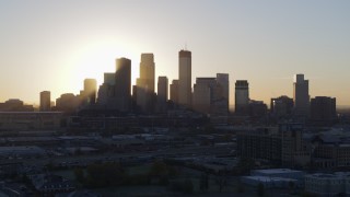 5.7K aerial stock footage a slow ascent while focusing on the city skyline at sunrise in Downtown Minneapolis, Minnesota Aerial Stock Footage | DX0001_002071