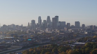 5.7K aerial stock footage slowly flyby the city's downtown skyline at sunrise during ascent in Downtown Minneapolis, Minnesota Aerial Stock Footage | DX0001_002095