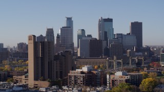 5.7K aerial stock footage flying by skyscrapers in city's skyline at sunrise in Downtown Minneapolis, Minnesota Aerial Stock Footage | DX0001_002102