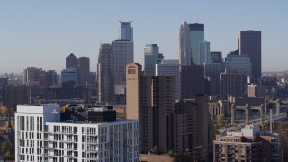 5.7K aerial stock footage of skyscrapers in city's skyline during descent at sunrise in Downtown Minneapolis, Minnesota Aerial Stock Footage | DX0001_002104