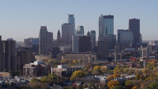 DX0001_002105 - 5.7K aerial stock footage of skyscrapers in city's skyline during ascent at sunrise in Downtown Minneapolis, Minnesota