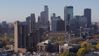 5.7K aerial stock footage flyby condo complex and city's skyline at sunrise in Downtown Minneapolis, Minnesota Aerial Stock Footage | DX0001_002109