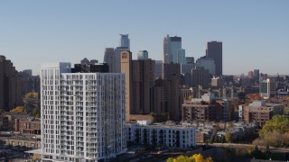 DX0001_002131 - 5.7K aerial stock footage the downtown skyline seen from residential buildings at sunrise in Downtown Minneapolis, Minnesota