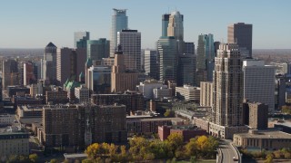 5.7K aerial stock footage pass by the city's skyline during descent, seen from the river, Downtown Minneapolis, Minnesota Aerial Stock Footage | DX0001_002156