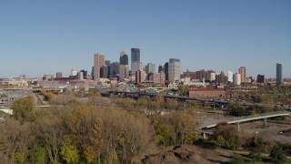 5.7K aerial stock footage ascend from park to approach the skyline of Downtown Minneapolis, Minnesota Aerial Stock Footage | DX0001_002166