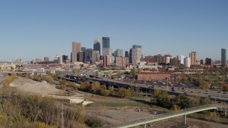 5.7K aerial stock footage flyby and away from the skyline of Downtown Minneapolis, Minnesota, seen from freeway Aerial Stock Footage | DX0001_002167