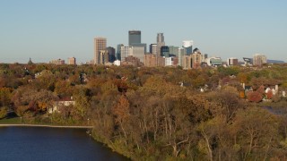 5.7K aerial stock footage ascend from lake to wide view of the city's skyline, Downtown Minneapolis, Minnesota Aerial Stock Footage | DX0001_002194