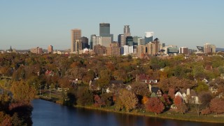 5.7K aerial stock footage of the city skyline, seen from lakeside homes, Downtown Minneapolis, Minnesota Aerial Stock Footage | DX0001_002205