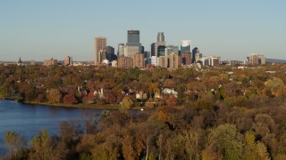 5.7K aerial stock footage of the skyline of Downtown Minneapolis, Minnesota seen from homes by the lake Aerial Stock Footage | DX0001_002209