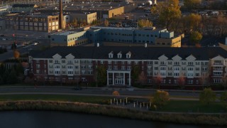 5.7K aerial stock footage of flying past an apartment building at sunset in Minneapolis, Minnesota Aerial Stock Footage | DX0001_002212