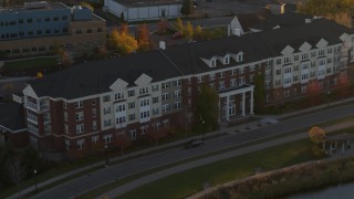 5.7K aerial stock footage of passing an apartment building at sunset in Minneapolis, Minnesota Aerial Stock Footage | DX0001_002213