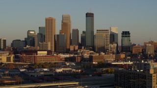 5.7K aerial stock footage of ascending by the city's downtown skyline at sunset in Downtown Minneapolis, Minnesota Aerial Stock Footage | DX0001_002219