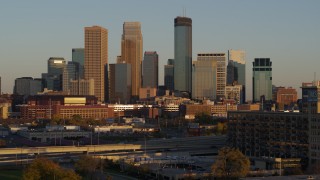 5.7K aerial stock footage the city's skyline at sunset while descending, Downtown Minneapolis, Minnesota Aerial Stock Footage | DX0001_002232