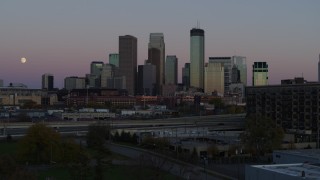 5.7K aerial stock footage ascend from park for view of the city's downtown skyline at twilight, Downtown Minneapolis, Minnesota Aerial Stock Footage | DX0001_002246