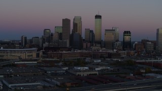 5.7K aerial stock footage of the city's downtown skyline at twilight during ascent, Downtown Minneapolis, Minnesota Aerial Stock Footage | DX0001_002250