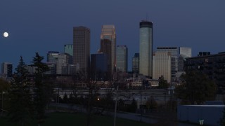 5.7K aerial stock footage a reverse view of skyscrapers in city skyline at twilight, Downtown Minneapolis, Minnesota Aerial Stock Footage | DX0001_002270