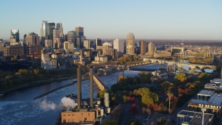 5.7K aerial stock footage ascend to stationary view of skyline across the Mississippi River, Downtown Minneapolis, Minnesota Aerial Stock Footage | DX0001_002298