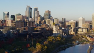 5.7K aerial stock footage flyby the city skyline seen from the river at sunrise, Downtown Minneapolis, Minnesota Aerial Stock Footage | DX0001_002307