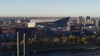 5.7K aerial stock footage of US Bank Stadium on the other side of the river at sunrise, Downtown Minneapolis, Minnesota Aerial Stock Footage | DX0001_002319