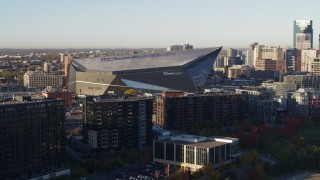 5.7K aerial stock footage of US Bank Stadium at sunrise while descending, Downtown Minneapolis, Minnesota Aerial Stock Footage | DX0001_002321