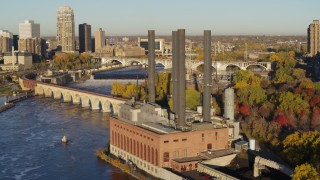 5.7K aerial stock footage of orbiting riverfront power plant at sunrise, Minneapolis, Minnesota Aerial Stock Footage | DX0001_002326