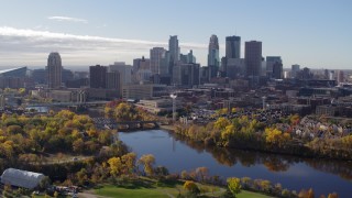 5.7K aerial stock footage a reverse view of the city's skyline seen from the river, Downtown Minneapolis, Minnesota Aerial Stock Footage | DX0001_002362