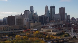 5.7K aerial stock footage of the skyline seen while flying by the Mississippi River, Downtown Minneapolis, Minnesota Aerial Stock Footage | DX0001_002370