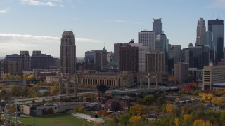 5.7K aerial stock footage of a residential skyscraper near bridge and other skyscrapers, Downtown Minneapolis, Minnesota Aerial Stock Footage | DX0001_002373