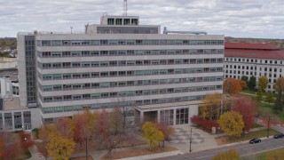 DX0001_002427 - 5.7K aerial stock footage of flying by a government office building during descent in Saint Paul, Minnesota