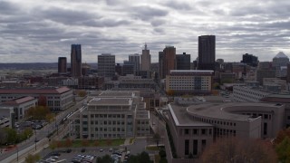 DX0001_002429 - 5.7K aerial stock footage of the city's skyline seen from a wide street, and ascend, Downtown Saint Paul, Minnesota