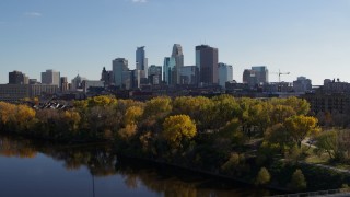 5.7K aerial stock footage flying by Mississippi River with view of skyline of Downtown Minneapolis, Minnesota Aerial Stock Footage | DX0001_002462