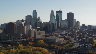 5.7K aerial stock footage focus on skyscrapers while descending by the city skyline, Downtown Minneapolis, Minnesota Aerial Stock Footage | DX0001_002473