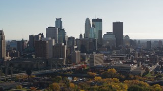 5.7K aerial stock footage focus on tall skyscrapers during ascent to stationary view of the city skyline, Downtown Minneapolis, Minnesota Aerial Stock Footage | DX0001_002479