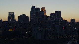 5.7K aerial stock footage slow flyby of the city skyline across the river at twilight, Downtown Minneapolis, Minnesota Aerial Stock Footage | DX0001_002565