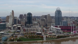 5.7K aerial stock footage focus on city skyline and baseball stadium during ascent from river, Downtown Cincinnati, Ohio Aerial Stock Footage | DX0001_002592