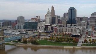 DX0001_002605 - 5.7K aerial stock footage ascend and approach city skyline from the Ohio River, Downtown Cincinnati, Ohio