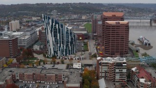 5.7K aerial stock footage of flying away from a condo complex and two riverfront office buildings in Covington, Kentucky Aerial Stock Footage | DX0001_002631