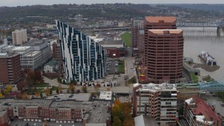 5.7K aerial stock footage of passing by a condo complex and two riverfront office buildings in Covington, Kentucky Aerial Stock Footage | DX0001_002632