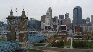 5.7K aerial stock footage fly close to the bridge and away from the city skyline, Downtown Cincinnati, Ohio Aerial Stock Footage | DX0001_002636