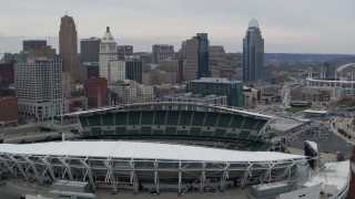 5.7K aerial stock footage fly away from tall skyscrapers, and flyby football stadium in Downtown Cincinnati, Ohio Aerial Stock Footage | DX0001_002673