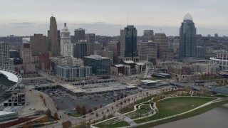 5.7K aerial stock footage of a reverse view of the city's skyline and Ferris wheel in Downtown Cincinnati, Ohio Aerial Stock Footage | DX0001_002678