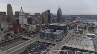 5.7K aerial stock footage reverse view of apartment and office buildings near skyscrapers seen from the football stadium in Downtown Cincinnati, Ohio Aerial Stock Footage | DX0001_002681