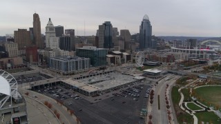 5.7K aerial stock footage pass apartment and office building near the skyscrapers of the city's skyline in Downtown Cincinnati, Ohio Aerial Stock Footage | DX0001_002691