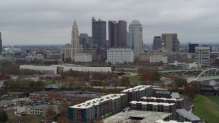 5.7K aerial stock footage of passing by the city's skyline, reveal Scioto River in Downtown Columbus, Ohio Aerial Stock Footage | DX0001_002694