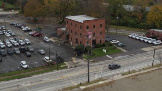 DX0001_002712 - 5.7K aerial stock footage of an orbit around a small brick police station in Columbus, Ohio