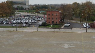 DX0001_002714 - 5.7K aerial stock footage of a reverse view of a brick police station in Columbus, Ohio