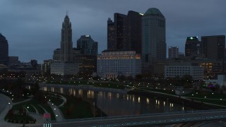 DX0001_002757 - 5.7K aerial stock footage flyby Scioto River and city skyline at sunset, Downtown Columbus, Ohio