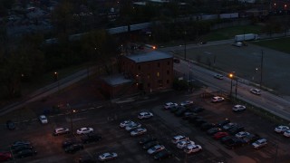 5.7K aerial stock footage of a reverse view of a brick police station at twilight in Columbus, Ohio Aerial Stock Footage | DX0001_002763