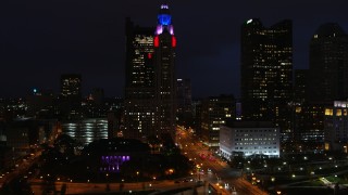 DX0001_002796 - 5.7K aerial stock footage of flying away from LeVeque Tower at night, Downtown Columbus, Ohio