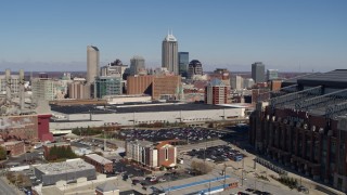 5.7K aerial stock footage reverse view of skyline behind convention center, reveal brick factory, Downtown Indianapolis, Indiana Aerial Stock Footage | DX0001_002807